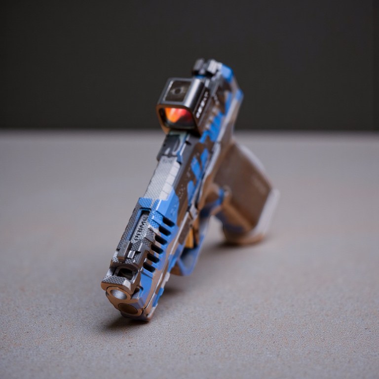 Blue custom pistol viewed from the front