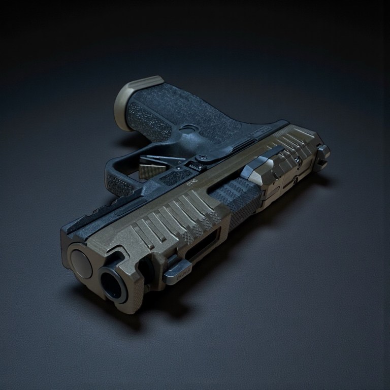 Dark custom pistol photographed from the front